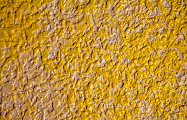 Abstract grainy texture on yellow and white wall. It can be used as a design elements and background