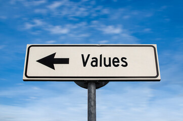 Values road sign, arrow on blue sky background. One way blank road sign with copy space. Arrow on a pole pointing in one direction.