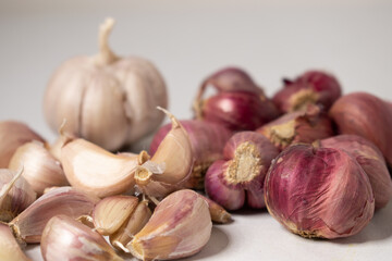 Red onion and garlic on a white background