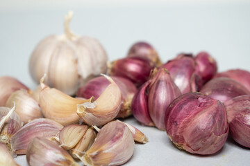 Red onion and garlic on a white background