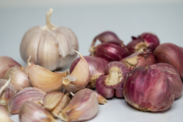 Red onion and garlic on a white background