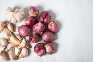 Red onion and garlic on a white background