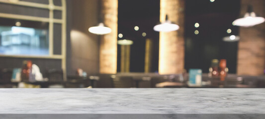 marble table top with blurred abstract cafe restaurant interior background