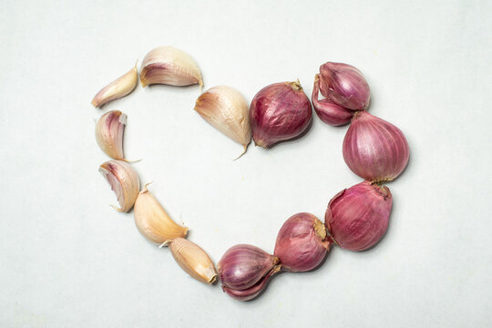Red onion and garlic on a white background