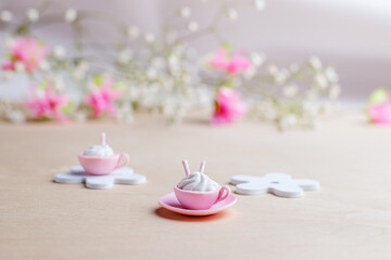 Miniature cup and plate made of pink polymer clay with marshmallow and waffle tube. 