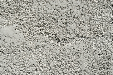 Aerated concrete texture. Abstract pattern on the surface of the briquette made of foamed concrete as a background. The cellular texture of the concrete.