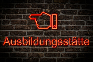 Fototapeta premium Leuchtreklame Ausbildungsstätte