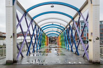 Colorful Bridge joining Niemeyer Center with the old town of Aviles, Spain
