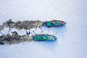 Two icebreakers breaking ice on Vistula river, Poland, 2020-02-18