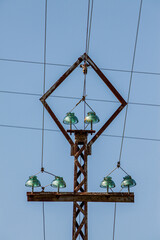 electricity pole with wires and blue sky