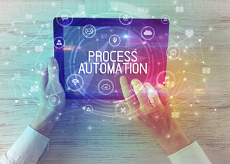 Close-up of a tablet with PROCESS AUTOMATION inscription, innovative technology concept