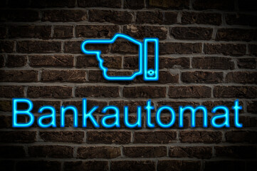 Obraz premium Leuchtreklame Bankautomat