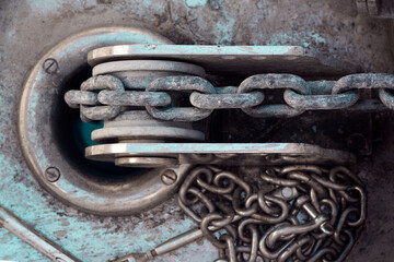 Vessel chain close up on windlass anchor winch capstan