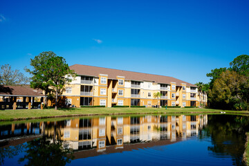 Fototapeta na wymiar Florida apartment and pond reflection 
