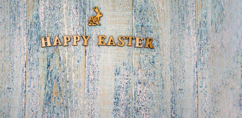 The Easter bunny. Holy Easter. Blue turquoise background. Happy Easter