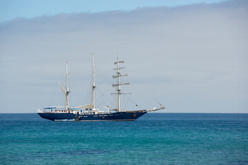 Fototapeta na wymiar Mary Anne anchored off Punta Cormorant, Floreana Island, Galapagos Islands, Ecuador