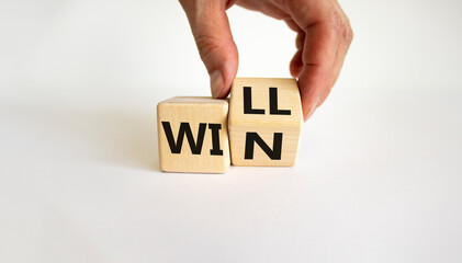We will win symbol. Businessman turns cubes and changes the word will to win. Beautiful white...