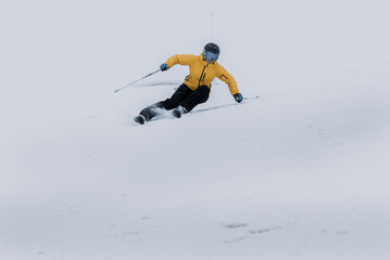 Young  woman skiing on a Cloudy day in Andorra.