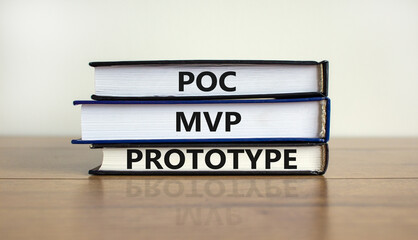 POC, MVP or prototype symbol. Books with words POC, proof of concept, MVP, minimum viable product...