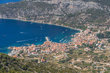 View of Komiza town coastline from mount Hum on Vis Island in Split Dalmatia region in Croatia summer