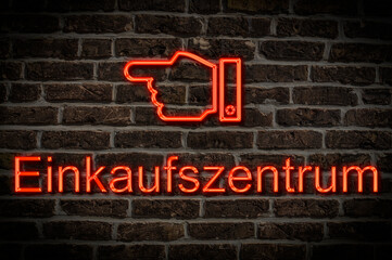 Fototapeta premium Leuchtreklame Einkaufszentrum