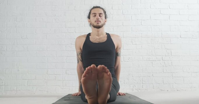 Yoga. Portrait of yogi men doing yoga exercise. working out, breathing exercise. Young men workout
