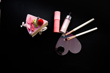 Cosmetics and accessories brush mirror on a black background. For the application of cosmetics for skin care and appearance
