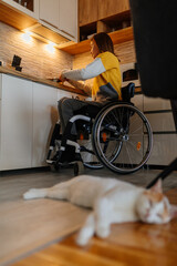 Woman in wheelchair cooking at home