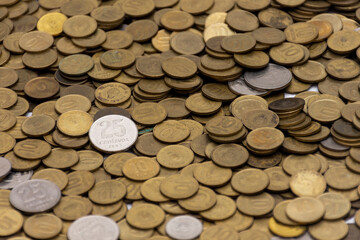 many coins from Argentina on a table.