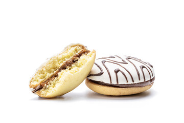 cookie with white icing and chocolate rows isolated on white background. sweet cake cut out