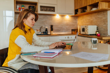 Disabled woman working at home with the help of technology