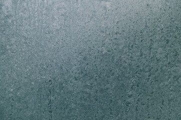 Ice crystals on glass in winter