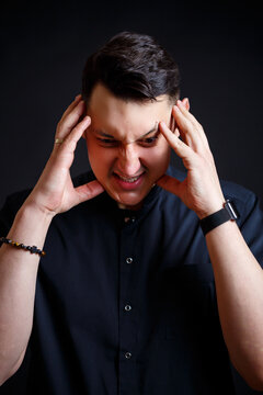 Emotional Close-up Portrait Of A Young Male Doctor In Medical Clothes. Isolated On Black Background