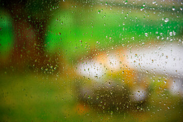 Rain drops on window glass during autumn