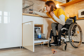 Female in wheelchair doing usual daily chores - obrazy, fototapety, plakaty