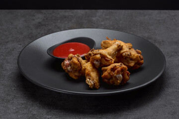 Spicy chicken wings in spicy spices, BBQ sauce