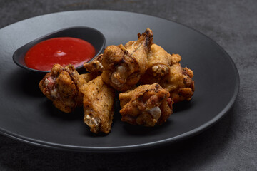 Spicy chicken wings in spicy spices, BBQ sauce