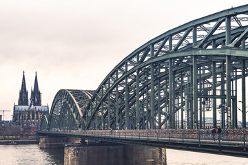 Hohenzollern Bridge over the Rhine River and Cologne Cathedral on sunset 