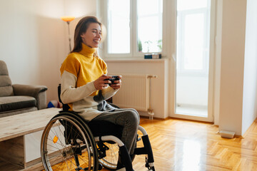 Young girl in wheelchair playing video games