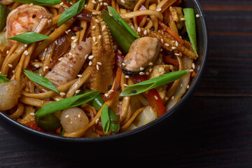 Ramen noodles with shrimp in bowl closeup