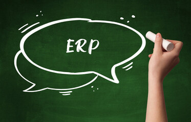 Hand drawing ERP abbreviation with white chalk on blackboard