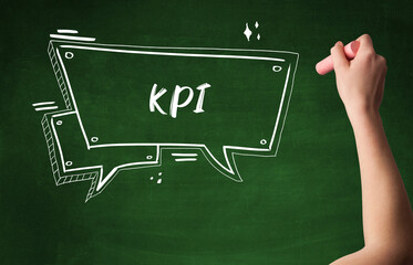 Hand drawing KPI abbreviation with white chalk on blackboard