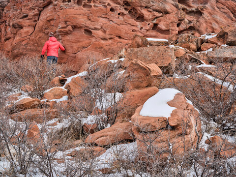 male hiker at sandstone rock formation  at Colorado foothills of Rocky Mountains - Lory State Park near Fort Collins in winter scenery