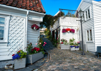 Street with Traditional white wooden houses in Gamle Stavanger