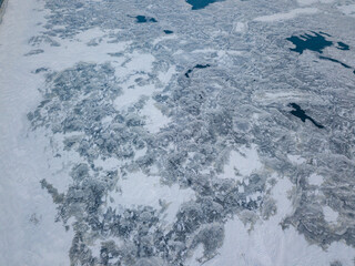 Ice crack on the river. Aerial drone view. Winter frosty morning.