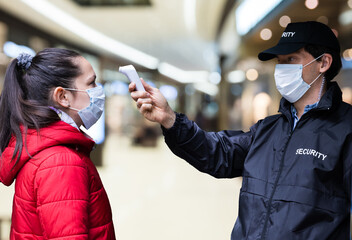 Security Guard Checking Temperature