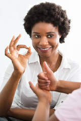 Deaf Mother Talking Sign Language With Her Daughter