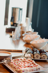 Delicious cakes on the catering table. Small pieces of cake. Coffee break