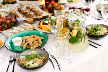 Festive table full of delicious food and snacks, beautiful serving, catering,lemonade