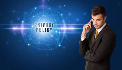 Businessman thinking about security solutions with PRIVACY POLICY inscription